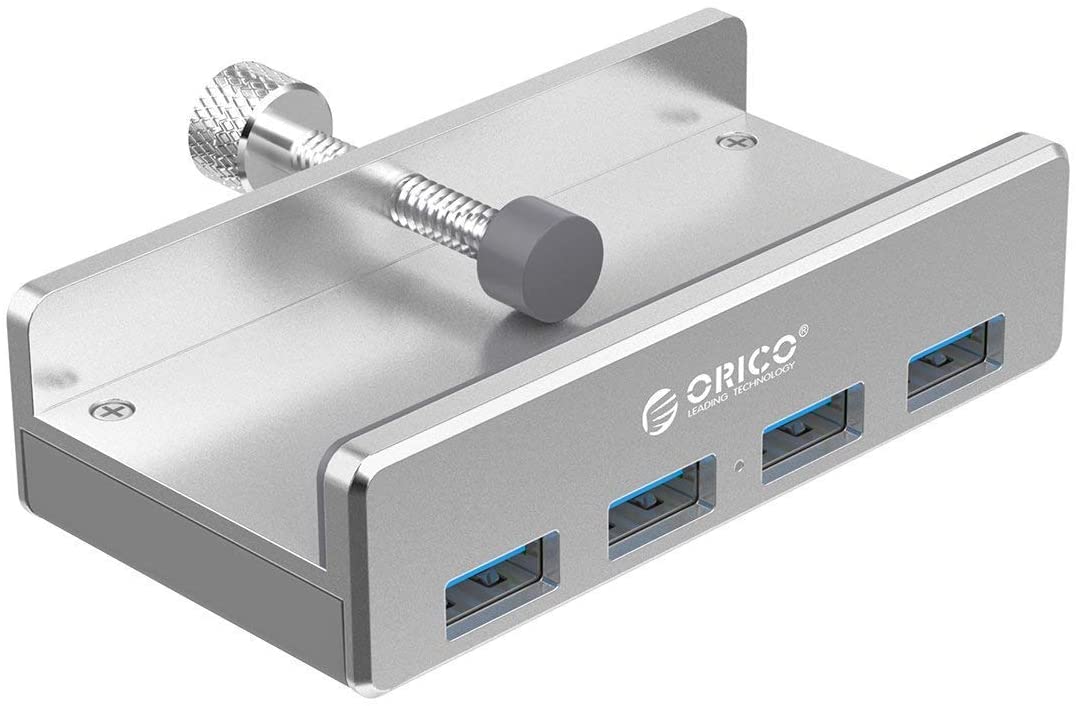 A photo of an Orico 4 port USB hub, which is silver in colour and has a clamp to attach it to a desk